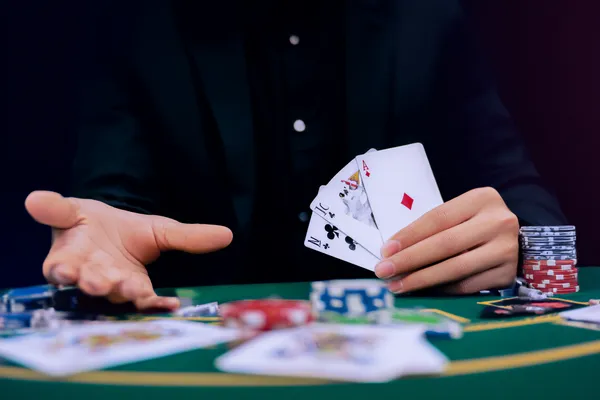 A player using their smartphone during a festive local event, representing MASAGANA’s fully mobile-friendly casino.