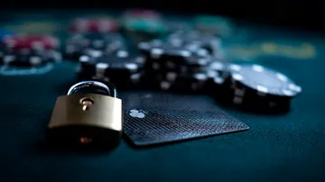 A laptop glowing with a bright login prompt in a minimalistic setup, symbolizing the protected access system at MASAGANA.